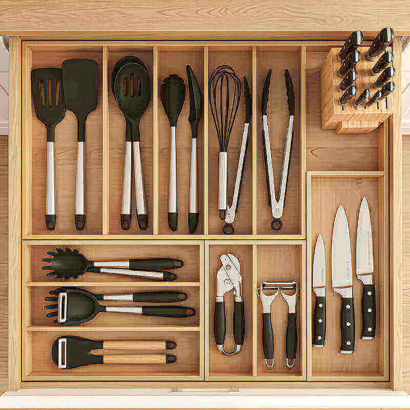 Adjustable drawer dividers organizing kitchen utensils and tools in small kitchen drawer