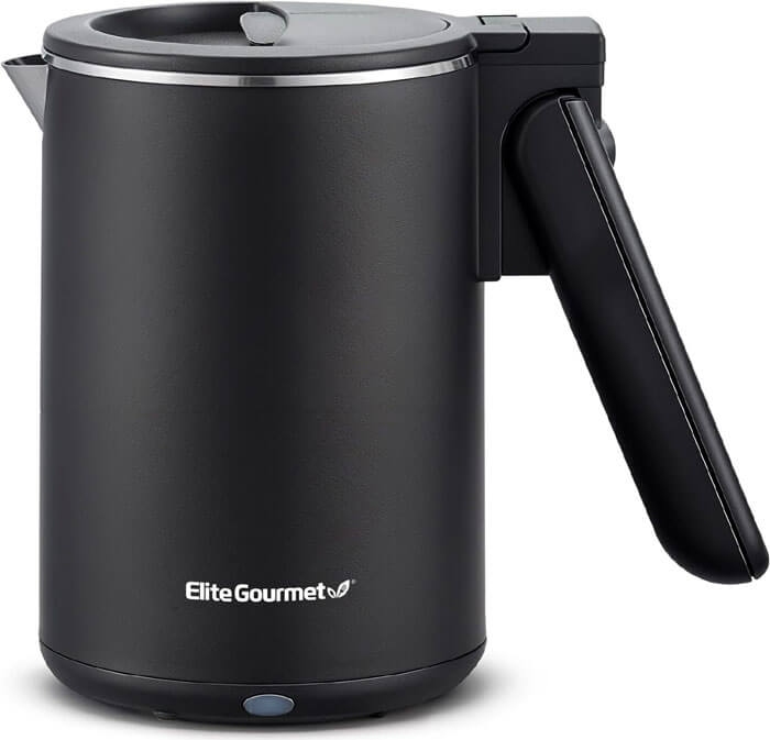 Elite Gourmet dual voltage travel kettle packed in suitcase, perfect for travelers and hotel rooms
