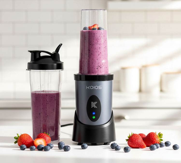 KOIOS 900W personal blender on counter with smoothie-filled cup and second portable cup, powerful budget-friendly blender for small kitchens