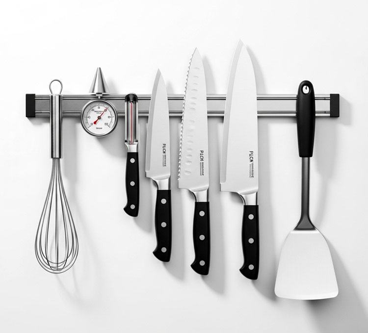 Modern Innovations magnetic knife bar on wall with knives and tools, frees counter space
