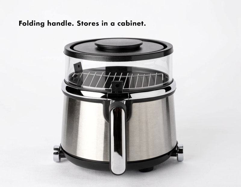 Basket air fryer with folding handle folded down for cabinet storage space-saving design