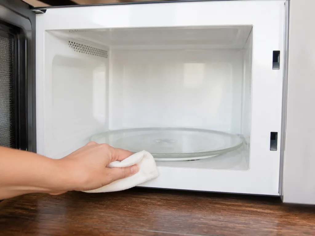 Clean The Turntable, Ring, And Crusty Edges - how to clean a microwave without harsh chemicals